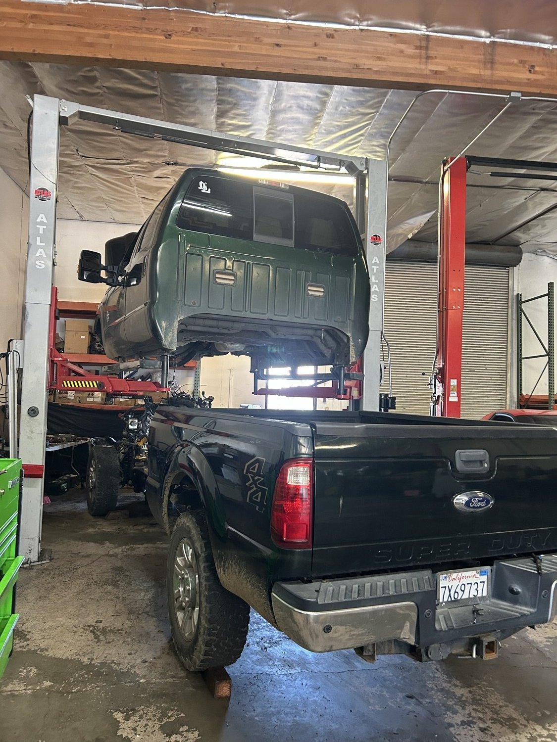 Ford Super Duty up on the lift at Sonny's Diesel & Performance